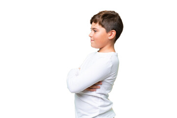 Little caucasian kid over isolated chroma key background in lateral position