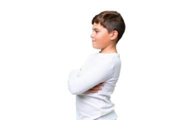 Little caucasian kid over isolated chroma key background in lateral position
