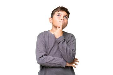 Little caucasian kid over isolated chroma key background having doubts while looking up