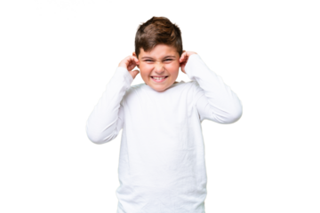 Little caucasian kid over isolated chroma key background frustrated and covering ears