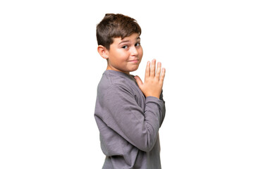 Little caucasian kid over isolated chroma key background scheming something