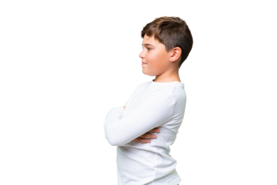 Little caucasian kid over isolated chroma key background in lateral position