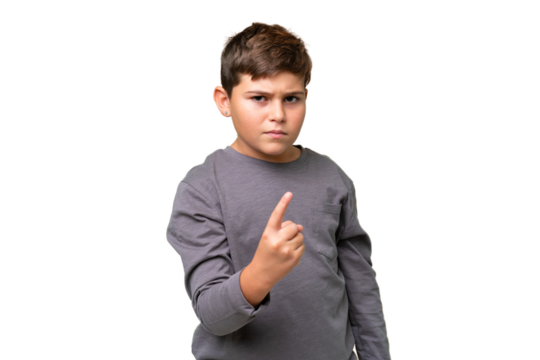 Little caucasian kid over isolated chroma key background frustrated and pointing to the front
