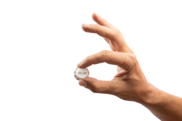 Hand turning volume control knob isolated no background cutout