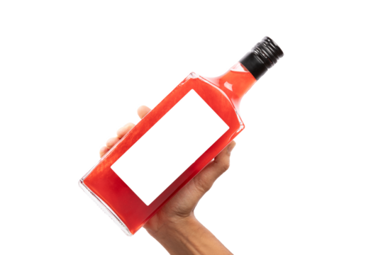 Black male hand holding bottle of red alcoholic drink isolated no background cutout