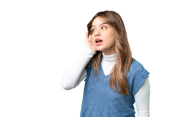 Young girl over isolated chroma key background listening to something by putting hand on the ear