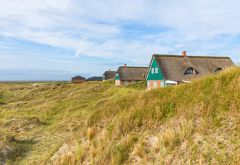 Thatched-roof summer houses in the dunes of Fanø, Denmark