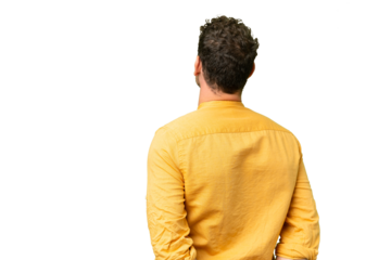 Brazilian man over isolated chroma key background in back position and looking back