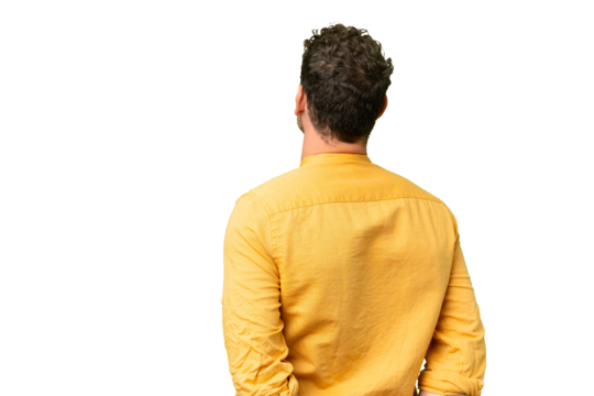 Brazilian man over isolated chroma key background in back position and looking back