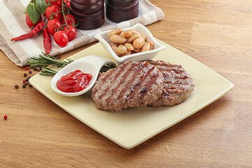 Grilled beef burger cutlet with sauce