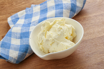 Italian soft mascarpone cheese in the bowl