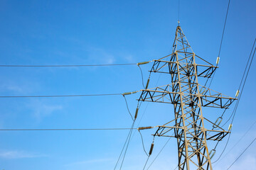 power line support with wires for electricity transmission. High voltage grid tower with wire cable at distribution station. Energy industry.