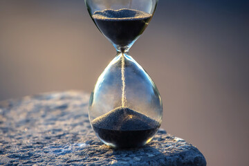 Hourglass counts the length of time against. The concept of the fluidity of life time in the universe. time and light
