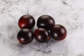 Raw ripe black kumato tomato