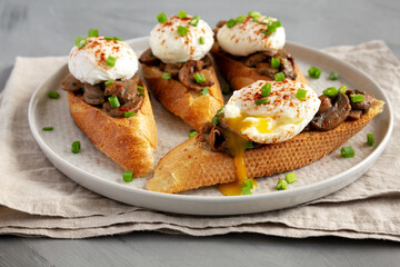 Homemade Creamy Mushroom Toasts on a Plate, side view.