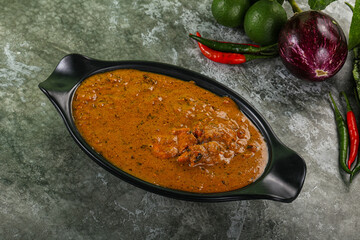 Indian cuisine - chicken curry with spices