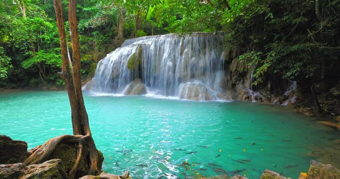 Blue water lake and waterfall in green rainforest. Thailand nature