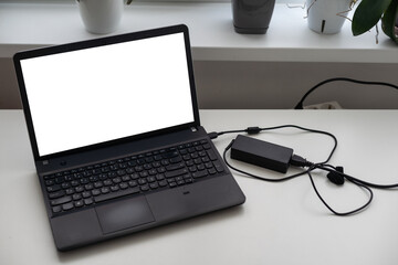 Image of charging a laptop