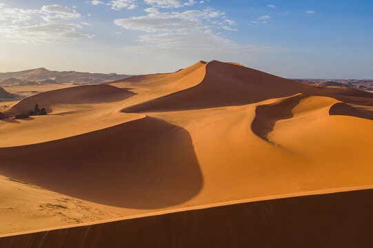 Aerial View of sand dunes at sunset in the Sahara desert, Djanet, Algeria, Africa.