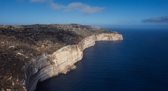 Aerial view of beautiful high cliffs along the coastline facing the Mediterranean Sea, Dingli, Malta.
