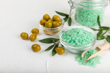 Spa sea salt on the test table. Sea salt with olive extract on the table. Beauty concept. Sea bath salt. Space for text, space for copy. Close-up.