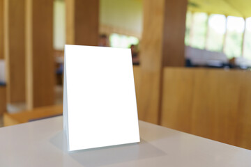 Mock up Menu frame standing on wood table in Bar restaurant cafe