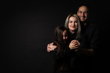 Family portrait on black background