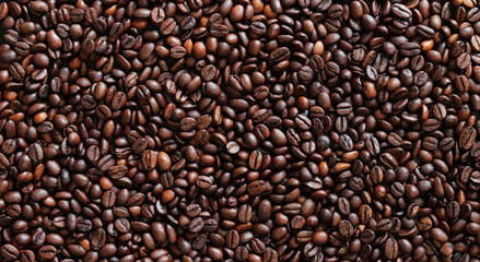 Top view of background representing halves of dark brown coffee beans. Roasted coffee beans, copy space