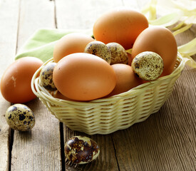 organic chicken and quail eggs in a basket