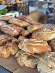 Different types of bread on a table at a weekly market - 663321343
