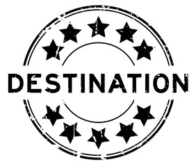 Grunge black destination word round rubber seal stamp on white background
