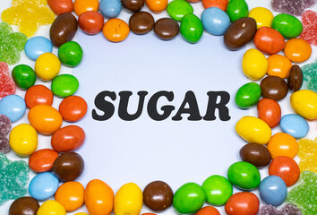 colorful candy background with text "SUGAR"
