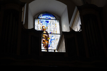 a mosaic icon on a window in a church