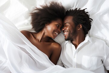 lovely afro american couple on bed peacefully sleeping looking at each other and smiling - obrazy, fototapety, plakaty