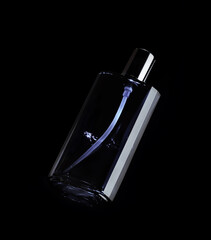 perfume bottle isolated on black background