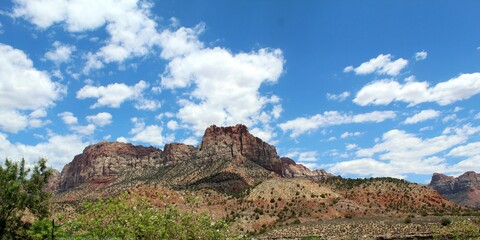 a view of a river and mountains, with a sky background