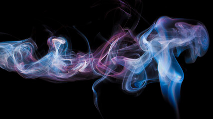 Fototapeta premium Vibrant color incense smoke on black
