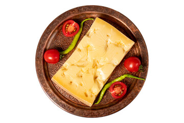 Gruyere cheese on a copper plate. Slices of gruyere cheese isolated on white background. Top view