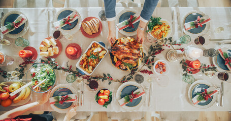 Top Down View Establishing Shot with Elegant Christmas Table with a Roast Turkey, Carefully...