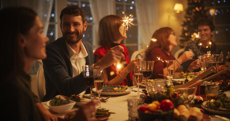 Parents, Children and Friends Enjoying Christmas Dinner Together in a Cozy Home in the Evening....