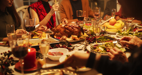 Merry Family Members Enjoy a Festive Meal, Share Food Around the Table and Having Funny Conversations and Happiness During a Christmas Turkey Dinner. Home Is Filled with Holiday Spirit