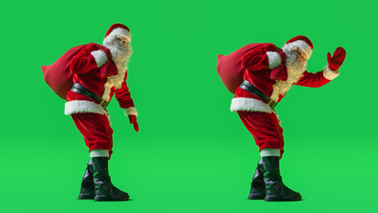 Studio Shot Isolated Mockup Template: Jolly Santa Claus with a Bag with Gifts For All Good Children On Green Screen Chromakey Background And Waving To Camera. Christmas And New Year