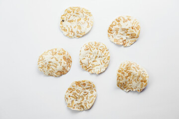 Keripik Tempe or Tempeh Chips are made from soybeans mixed with rice flour then sliced ​​thinly. Isolated on white background.
