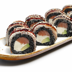 Sushi set canada and black rice on a white background, selective focus. Japanese kitchen. Sushi menu