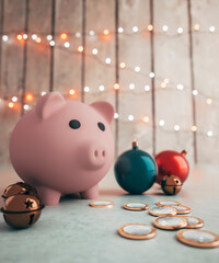 large Piggy bank saving for Christmas surround by colourful decorations 3d render