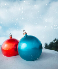 Red and blue Chiny baubles outside on a snowy day close up 3d render