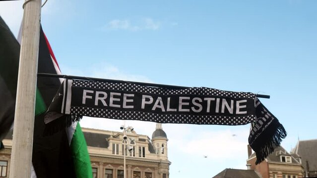 Banners with Free Palestine at Pro Palestine demonstration in Amsterdam, Netherlands.