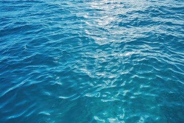 Fototapeta na wymiar Beautiful turquoise blue ocean water surface wallpaper background,wallpaper background about blue ocean 