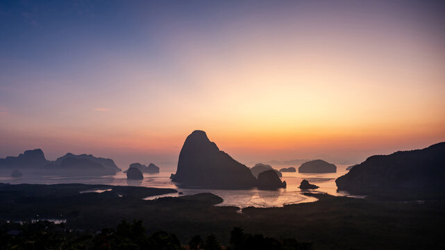 Beautiful Phang Nga Bay during sunrise. View from Samed Nang Chee or Samat Nangshe viewpoint, one of natural landmarks and travel destinations in Phang Nga Province, Thailand.