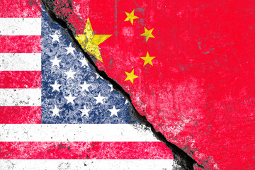 Crack of wall to separate between USA flag and China flag for military war , Economic technology competition and politic conflict concept.